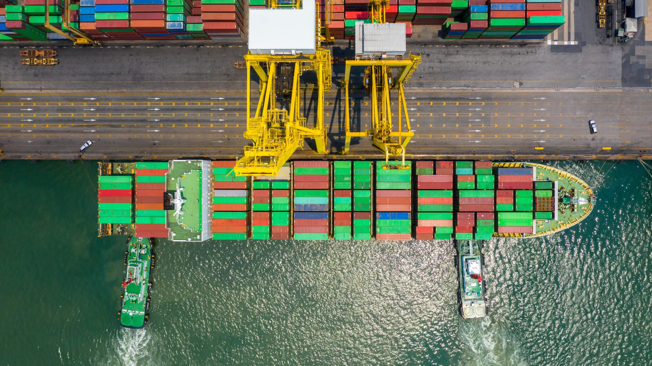 Aerial view container ship at comercial container terminal port,